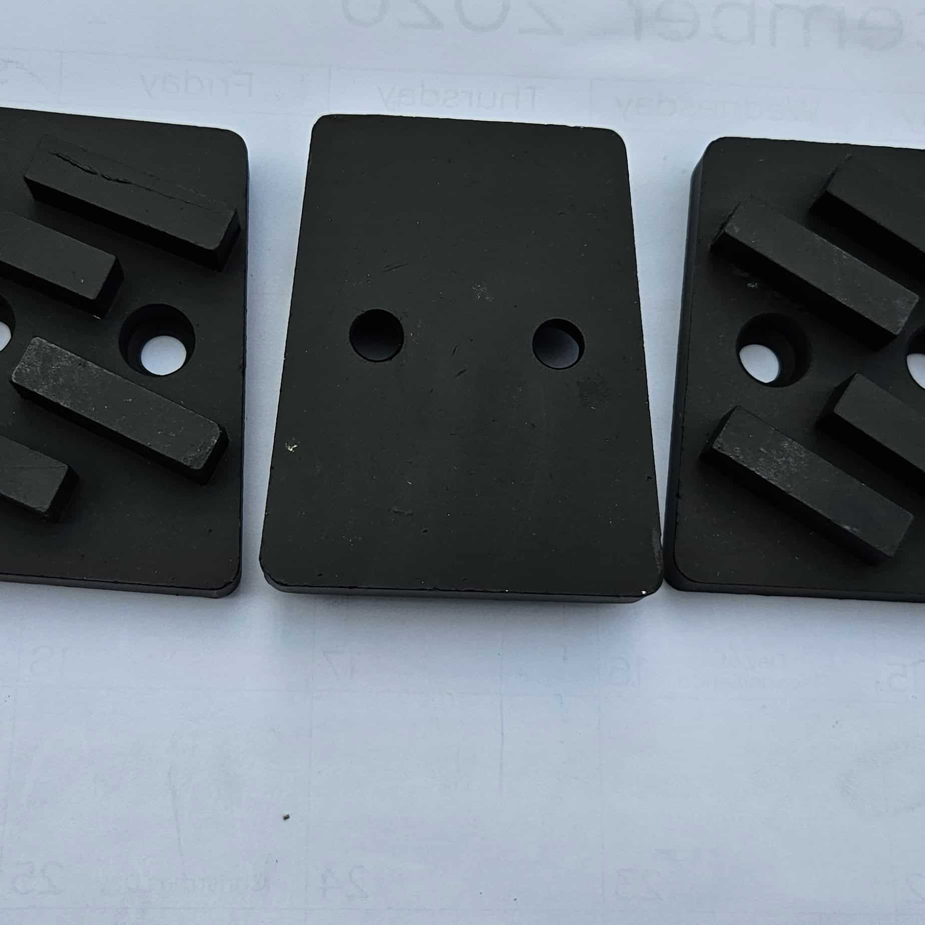 Diamond grinding wedge segments close-up – dual bolt-hole mounting for floor grinding machines
